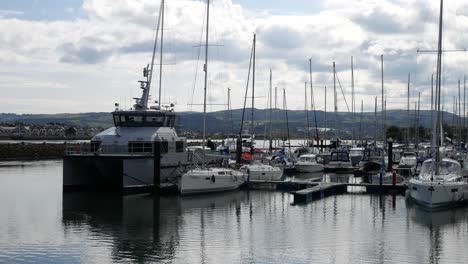 fisheries boats and yachts moored on sunny luxury conwy welsh marina north wales