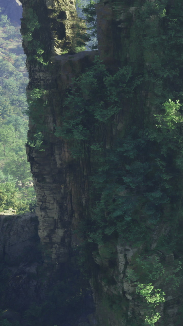 View of a steep cliff covered in green plants in a mountainous area