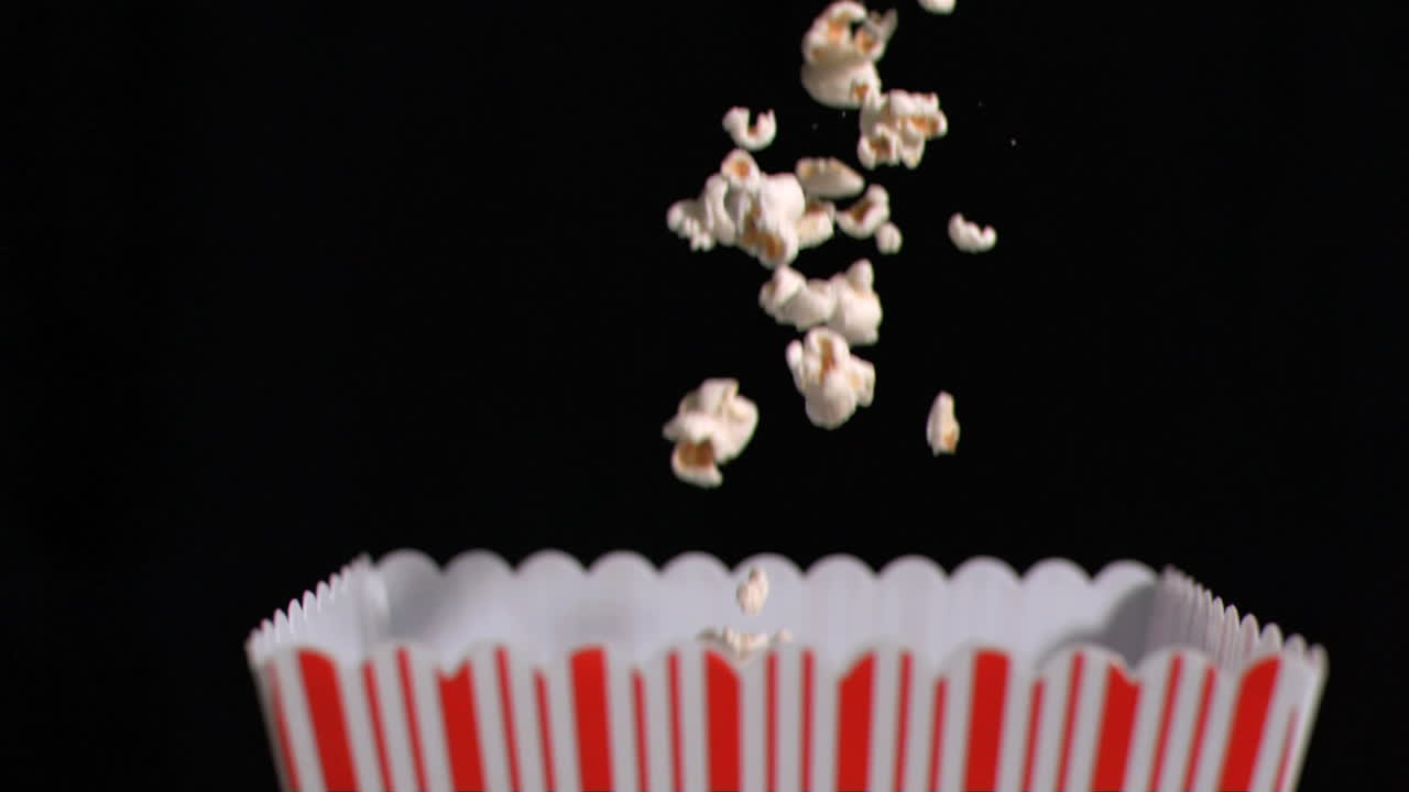 Popcorn falling into box in super slow motion