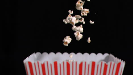 popcorn falling into box in super slow motion