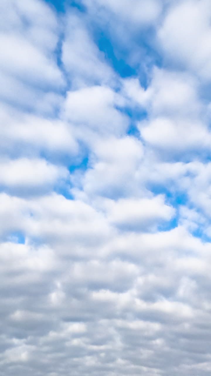 Beautiful outdoor cloudy time lapse. Clouds on a blue white sky.