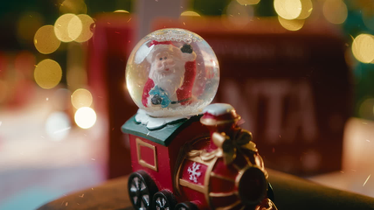 Little Santa Claus train with falling snow at Christmas