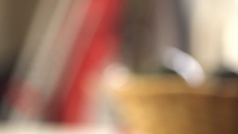 close up shot of a man grabing a boiling tea pot