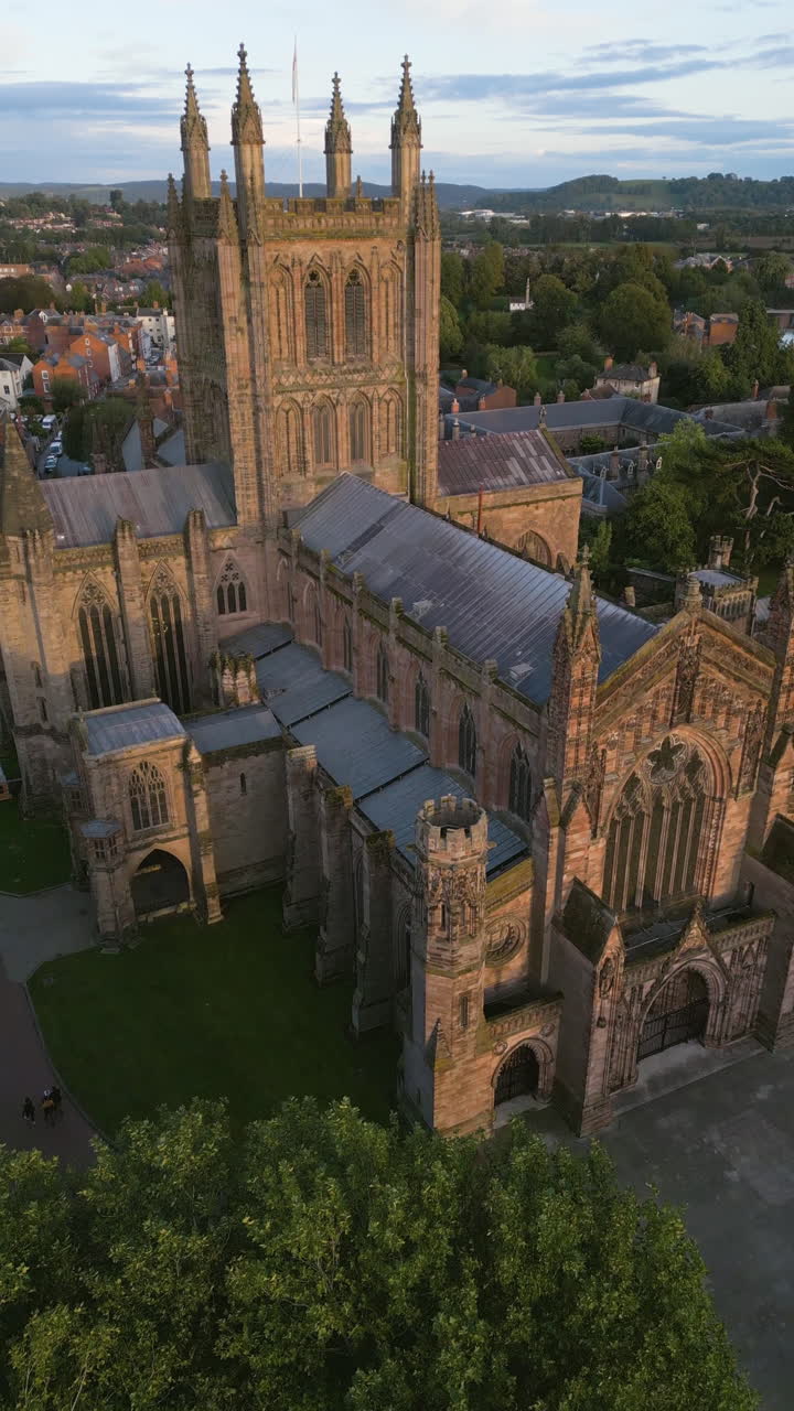 Vertical drone shot approaching the Hereford Cathedral, sunset in United Kingdom