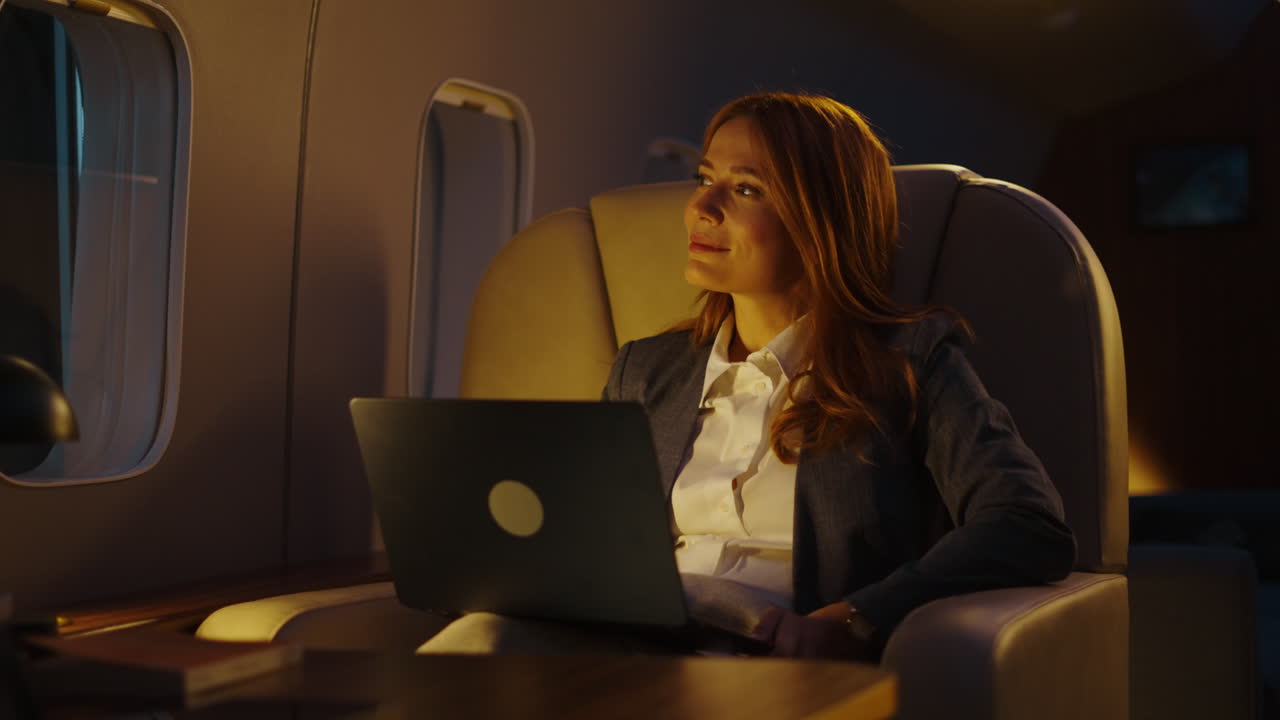 Business woman traveling on a private jet