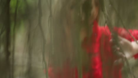 young woman among tree roots