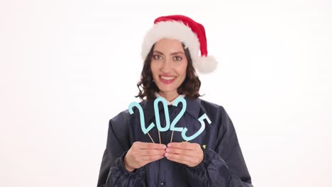 woman in santa hat holding 2023 numbers for new year celebration