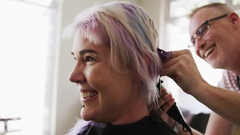 side view woman shaving her hair at the hairdresser