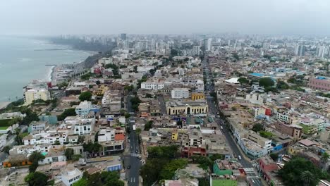 drone view over lima peru, high buildings and ocean on the background