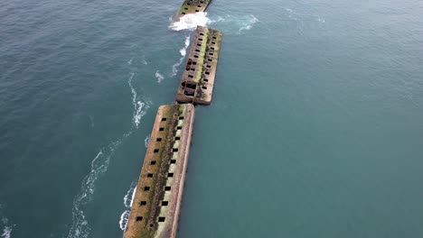 Aerial-view-of-mulberry-harbor-ocean-ruins-from-WW2-in-Normandy-France