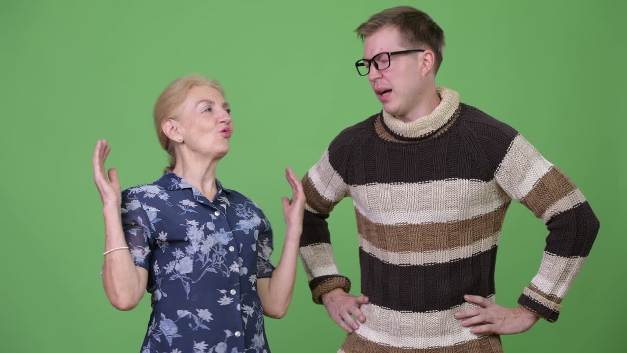 Grandmother and grandson looking upset together