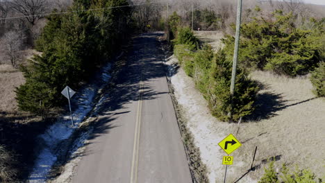 aerial footage of road cyclists on country road