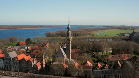 aerial: the historical town of veere with an old harbour and churches, on a spring day