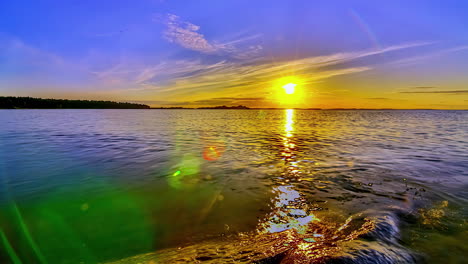 magical lake sunset with colorful sky, hyper lapse following sun