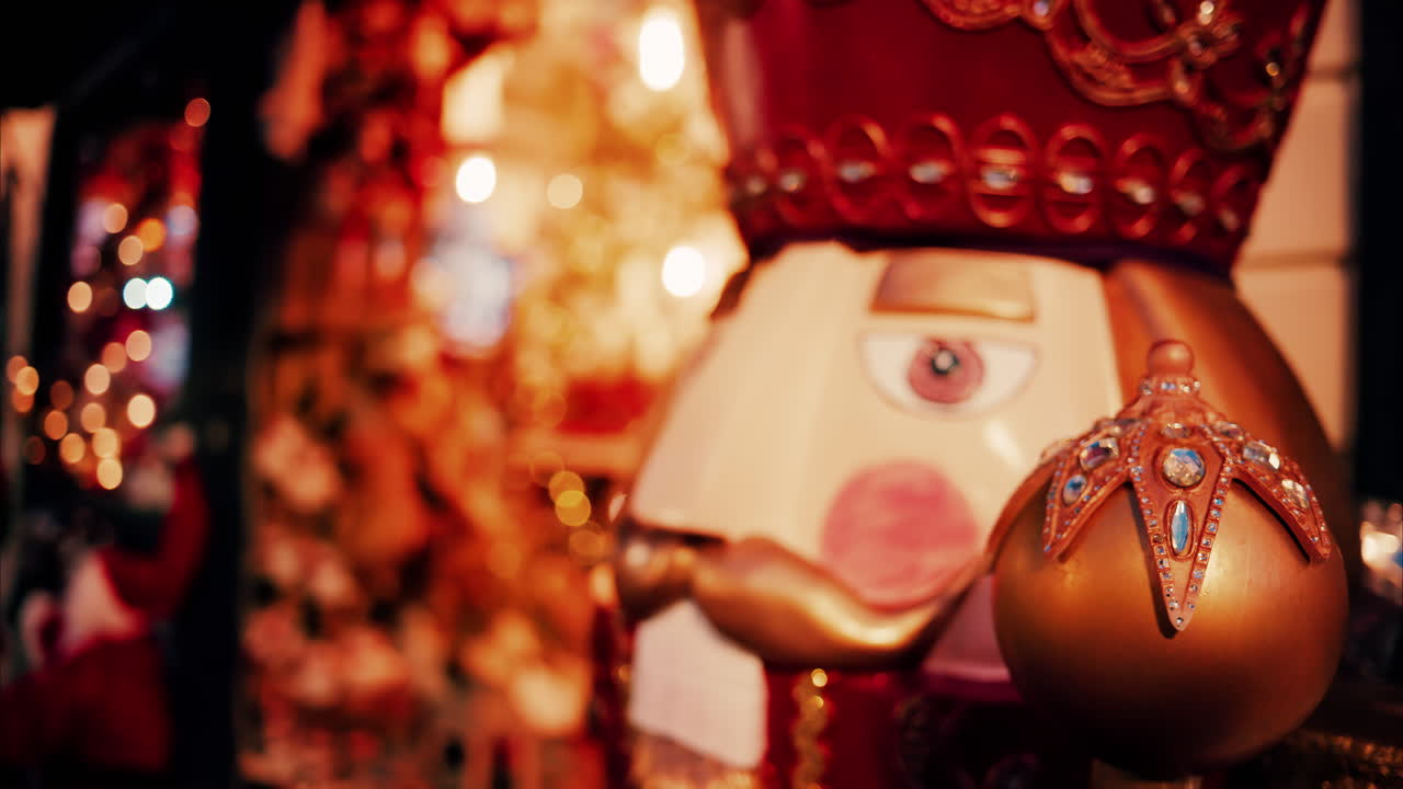 Close up of a big nutcracker figurine with blurry lights on the background