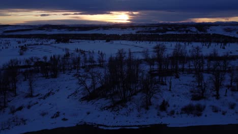 golden skies over canadian winter communities: aerial footage