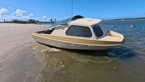 a boat gently moves along the shore