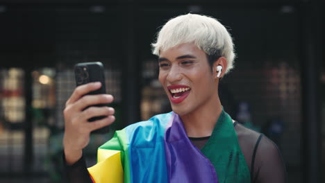 person having a video call with pride flag