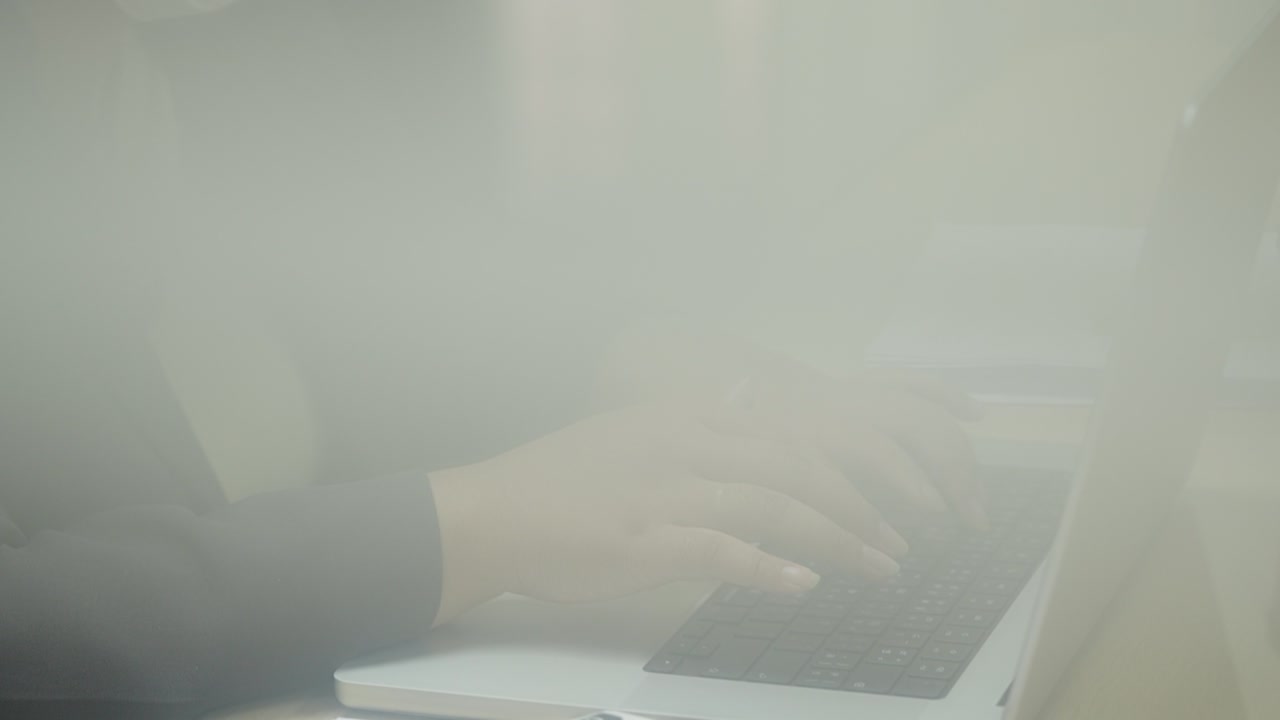 Businesswoman hands typing on laptop computer keyboard for searching information,marketing research report in the office desk