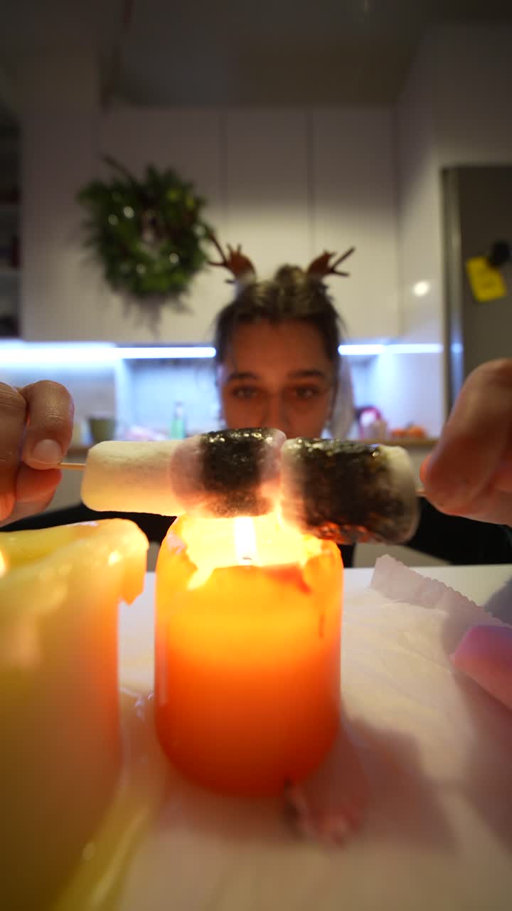 Woman Toasting Marshmallows with Candles