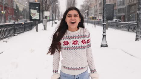 woman enjoying a snowy day in the city