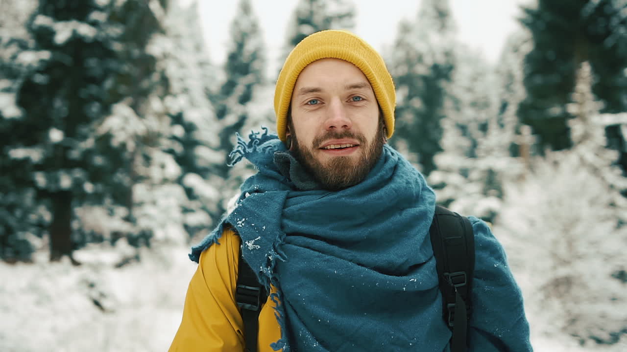 Man in winter forest with snow