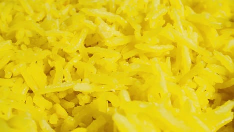 macro probe shot of cooked yellow basmati rice.