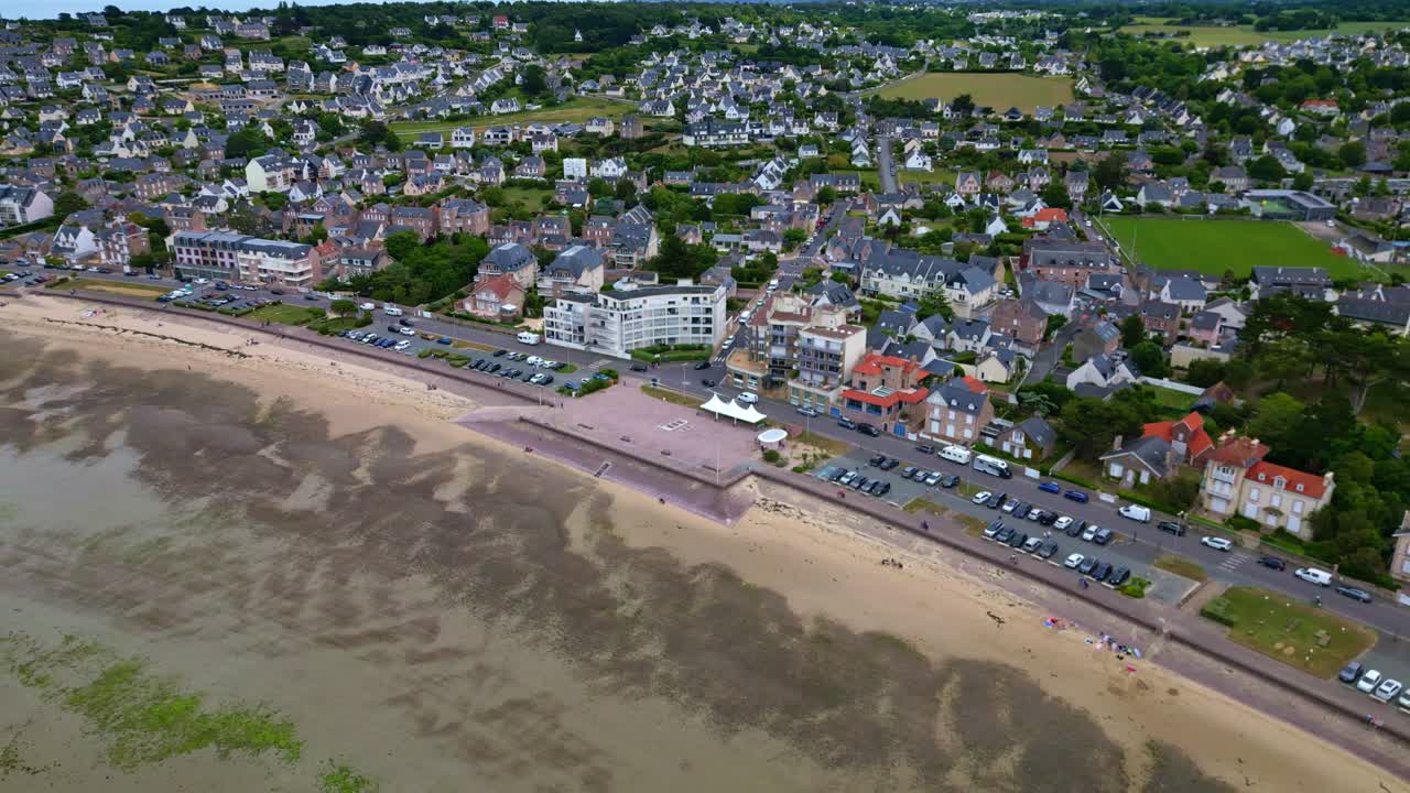 Aerial view over Erquy showing the city, beach, and sandbanks at low tide. France