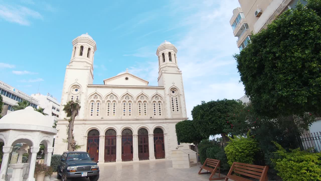Ayia Napa Cathedral at the Heart of Limassol’s Seafront contrasting with Cyprus Blue sky - Wide Slide Reveal shot
