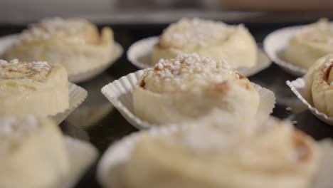 fast slide of cinnamon buns on a tray