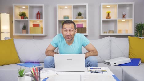 home office worker man making cute gesture at camera.