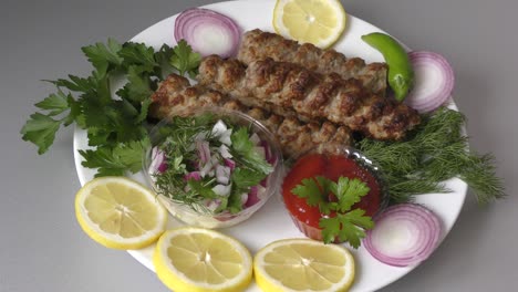 lula-kebab with fresh herbs and sauce