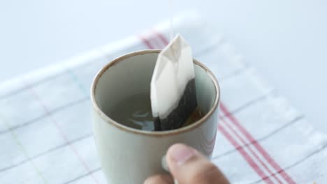 women hand preparing green tea