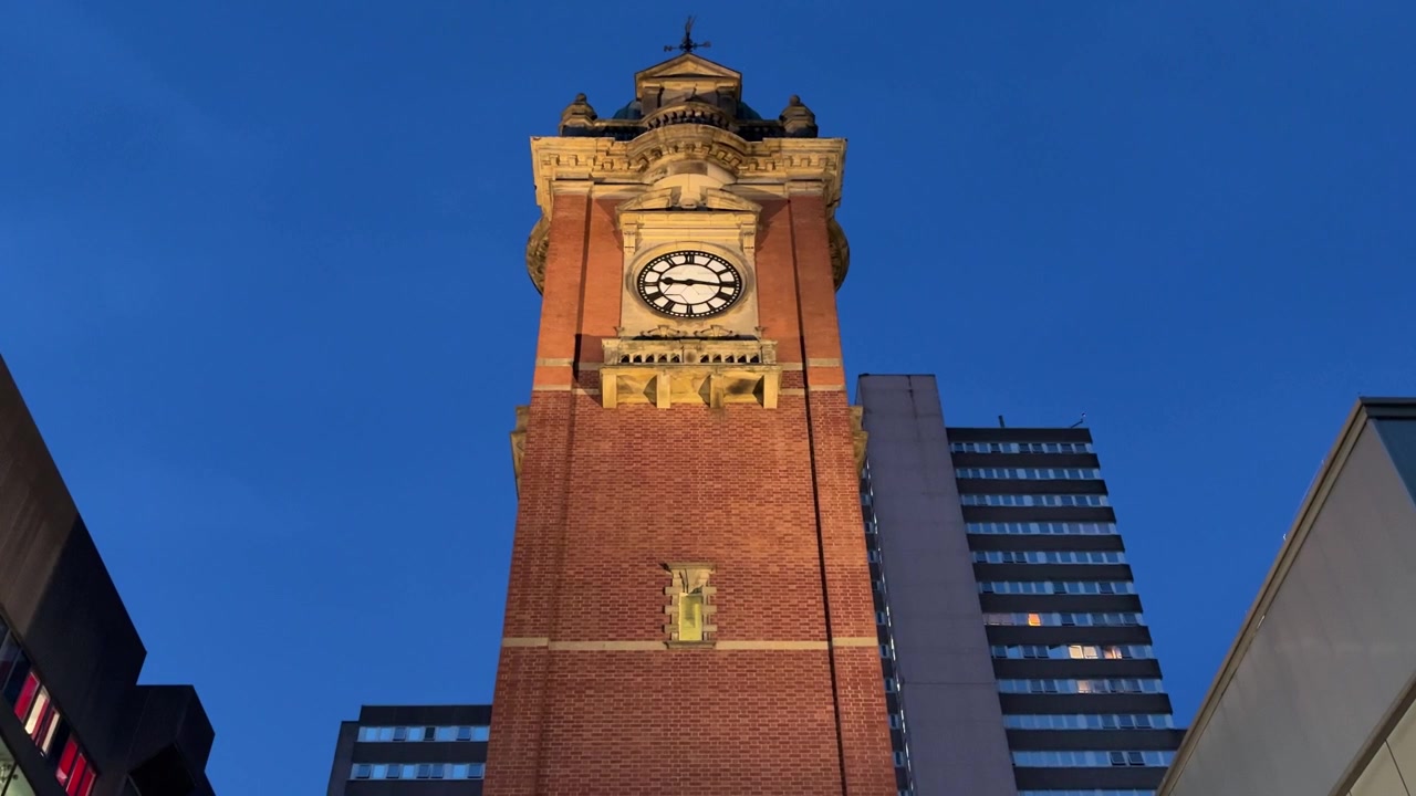 View of the Victoria Centre Clock Tower on Milton Street in Nottingham city centre, featuring a well-known urban landmark and shopping district setting.
