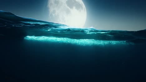 moonlit ocean surfaces create enchanting turquoise reflections while diving underwater, revealing a serene nighttime seascape