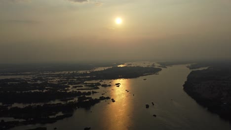 a magical sunset over the mekong river, the so called 4000 islands in the south of laos