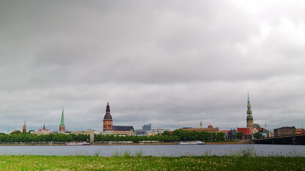 Timelapse captures Riga’s iconic church towers framed by clouds across Daugava