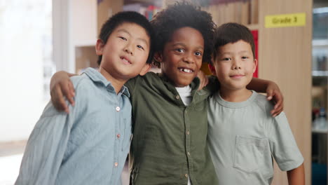 three smiling students hugging in a classroom