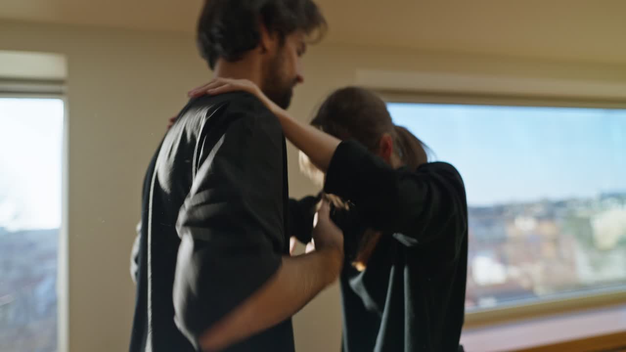 People hugging indoors