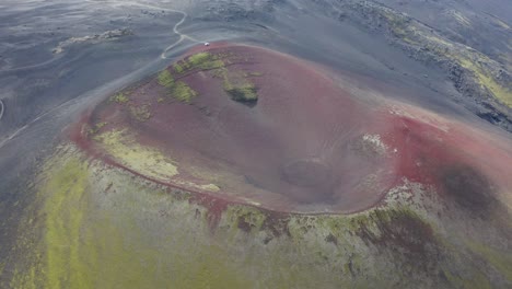 aerial top down shot of red crater of raudaskal volcano on iceland island