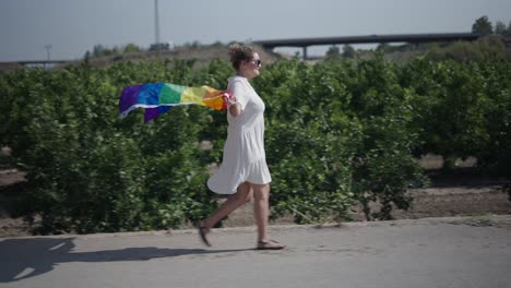 Woman Walking with Pride Flag