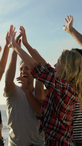 group of friends doing high five