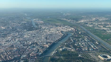 aerial panoramic view of seville city, spain, shot from an airplane cabin during the departure at 3000m high