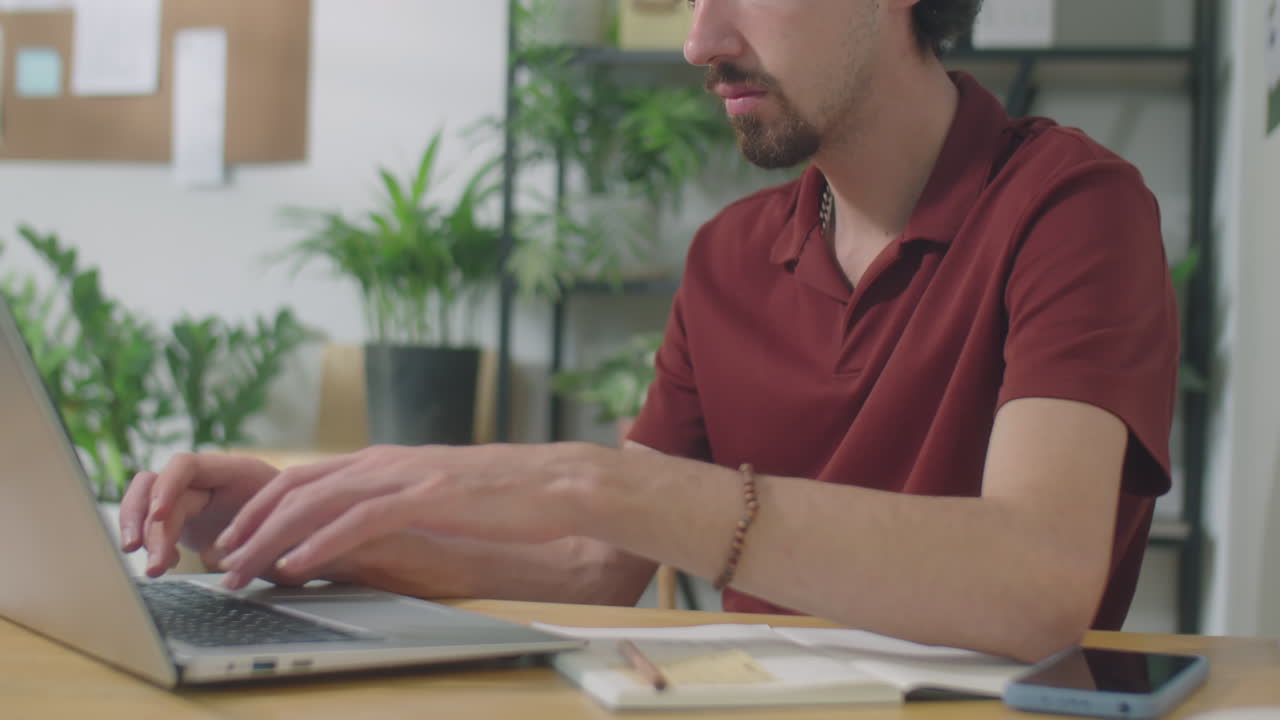 Man Working on Laptop during Office Workday