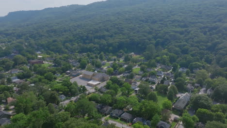 high altitude drone shot showing st. elmo tucked beneath the sloping mountains of chattanooga