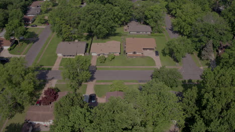 aerial-flyover-suburban-streets-and-houses-in-a-quiet-neighborhood-in-the-summer