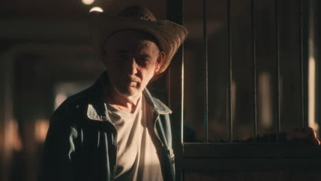 senior man in a stable