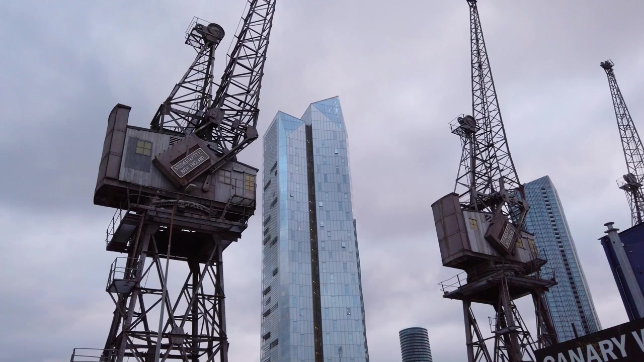 Drone shot of cranes in Canary Wharf Business District in London