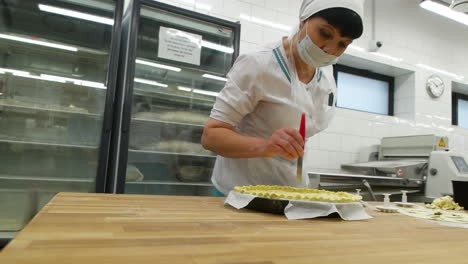 woman baking pies in a bakery