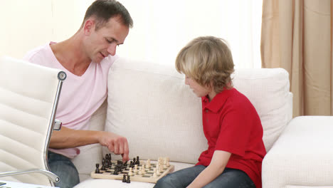 father and son playing chess